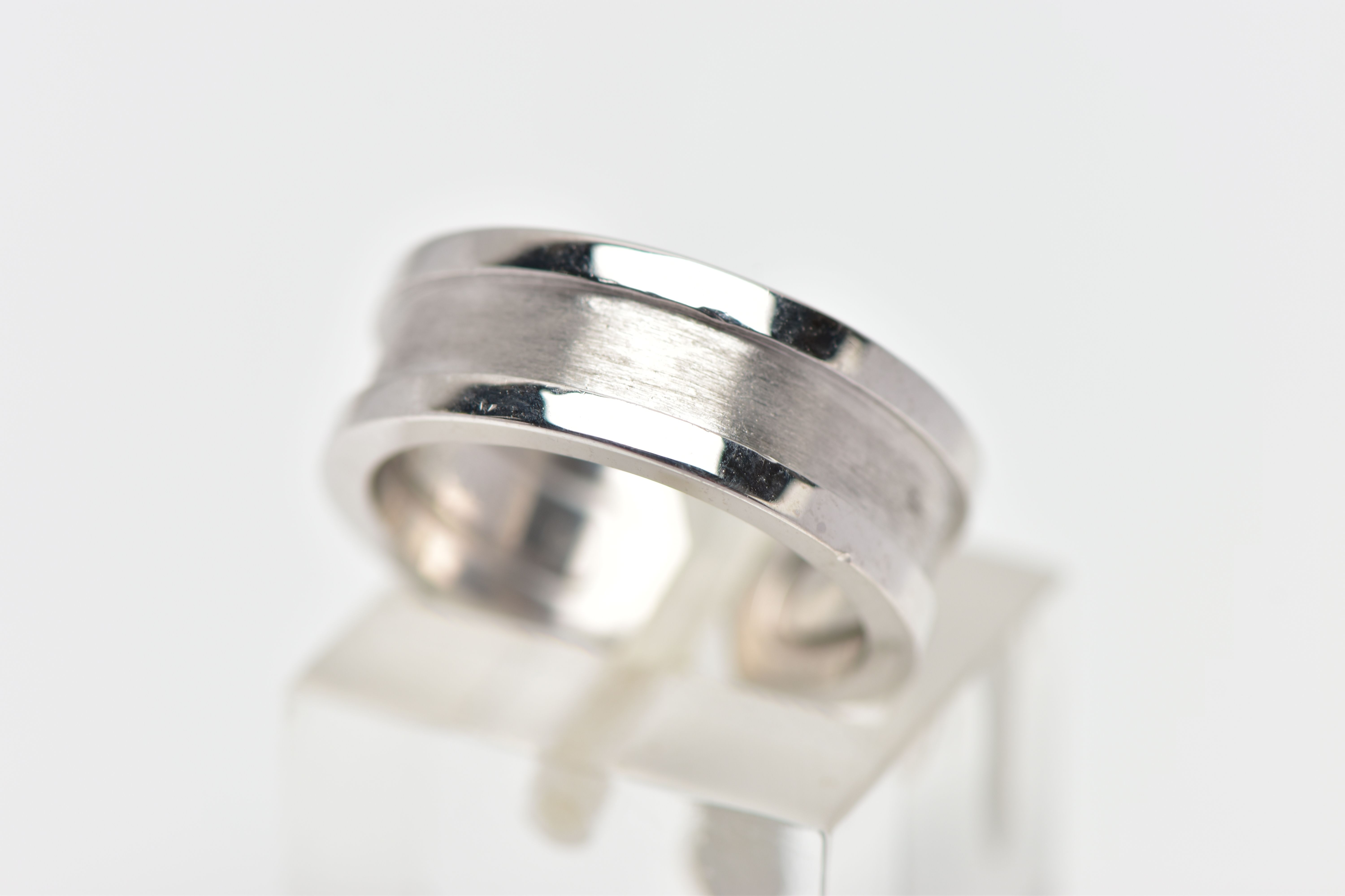 A 'C DE CARTIER' RING BY CARTIER, with polished and brushed detail, signed and numbered Cartier