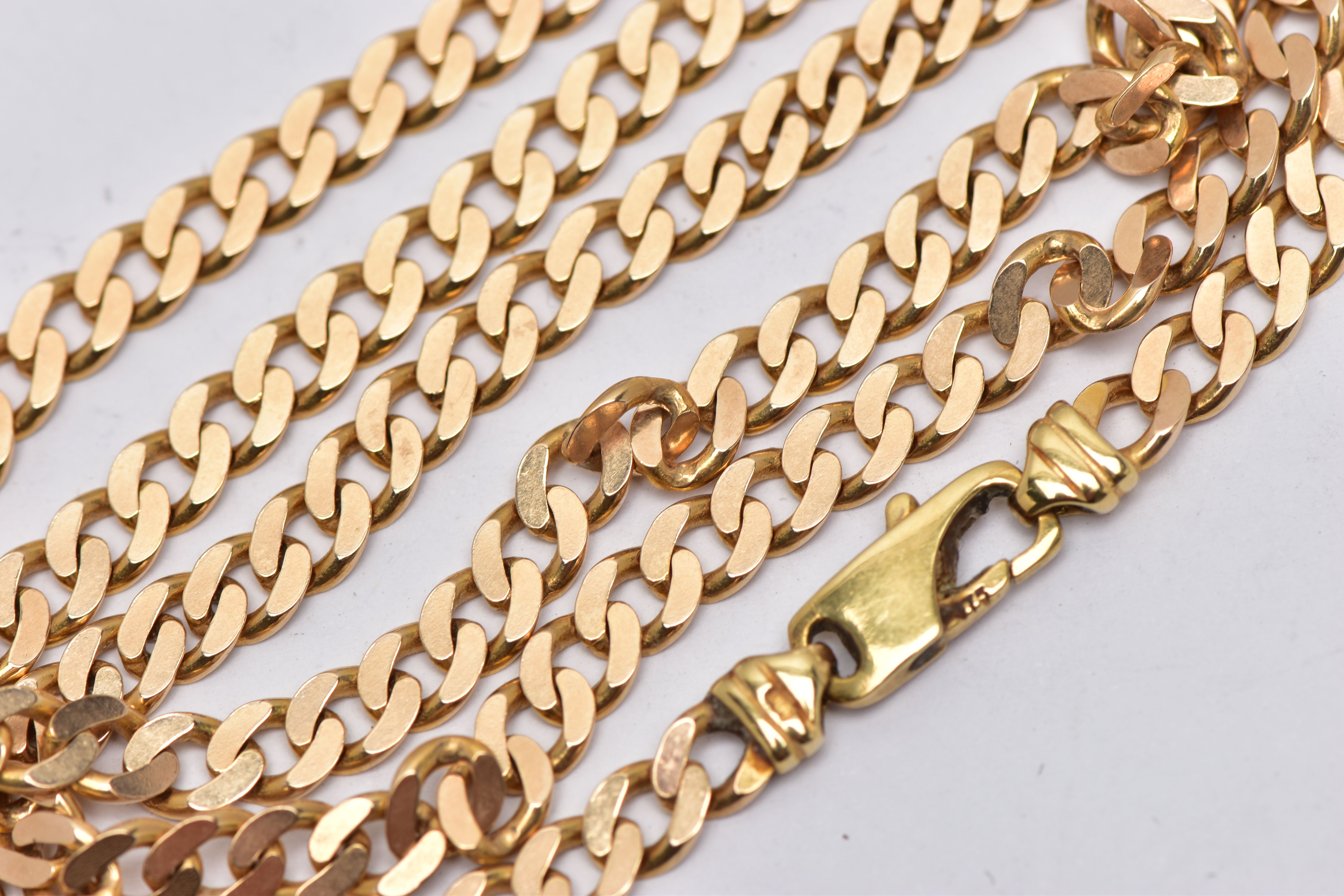 A YELLOW METAL NECKLACE, desiged as a flat curb link chain with lobster clasp, approximate length - Image 2 of 2