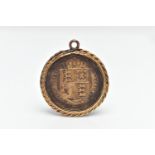 A QUEEN VICTORIA GOLD WASHED SHILLING AND PENDANT, the silver coin dated 1887, fitted inside a