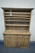 A 19TH CENTURY PINE DRESSER, with three shelves, above a base with two drawers and panel doors,