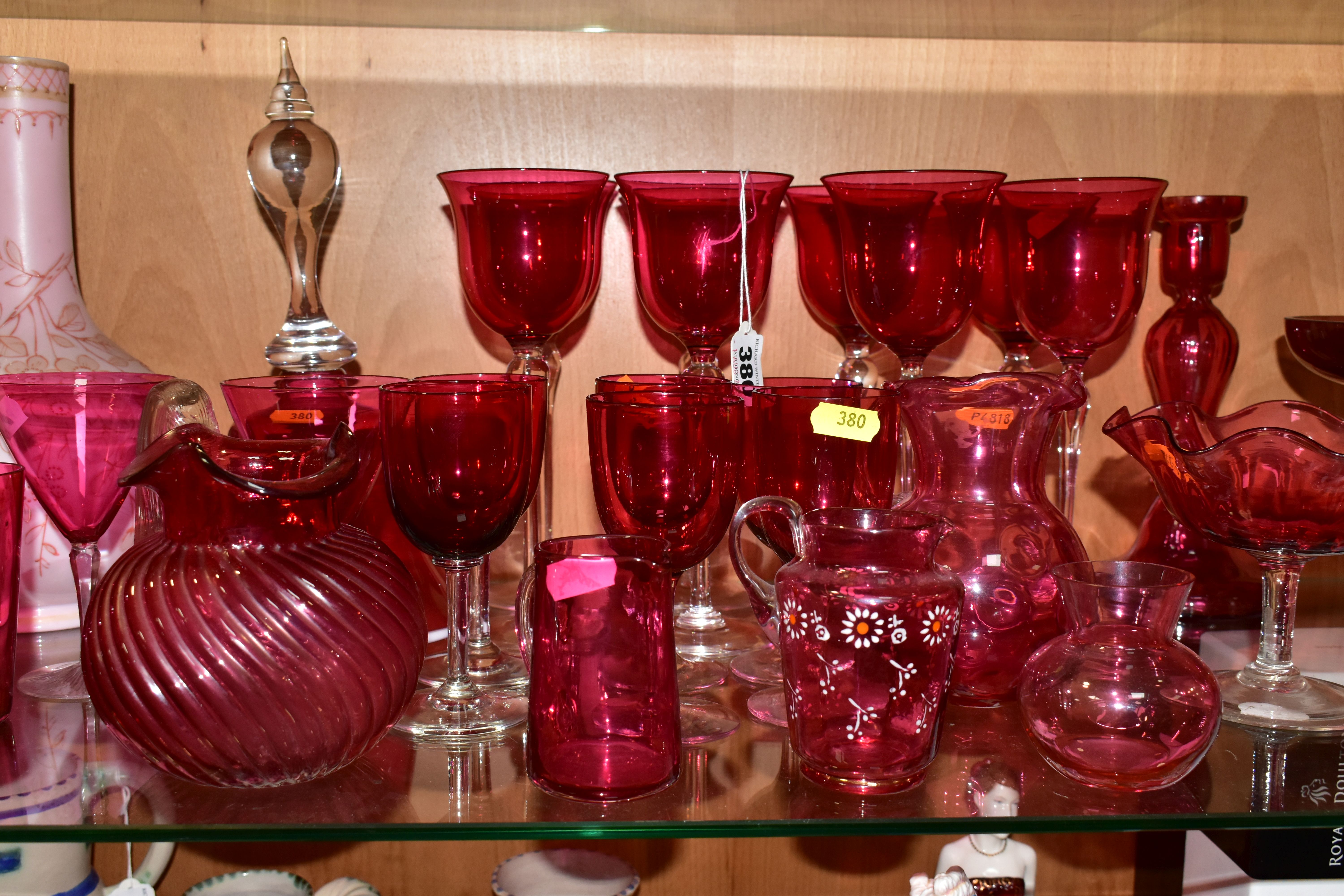 A COLLECTION OF VICTORIAN AND 20TH CENTURY COLOURED GLASSWARE, mostly cranberry glass, including a