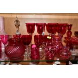 A COLLECTION OF VICTORIAN AND 20TH CENTURY COLOURED GLASSWARE, mostly cranberry glass, including a