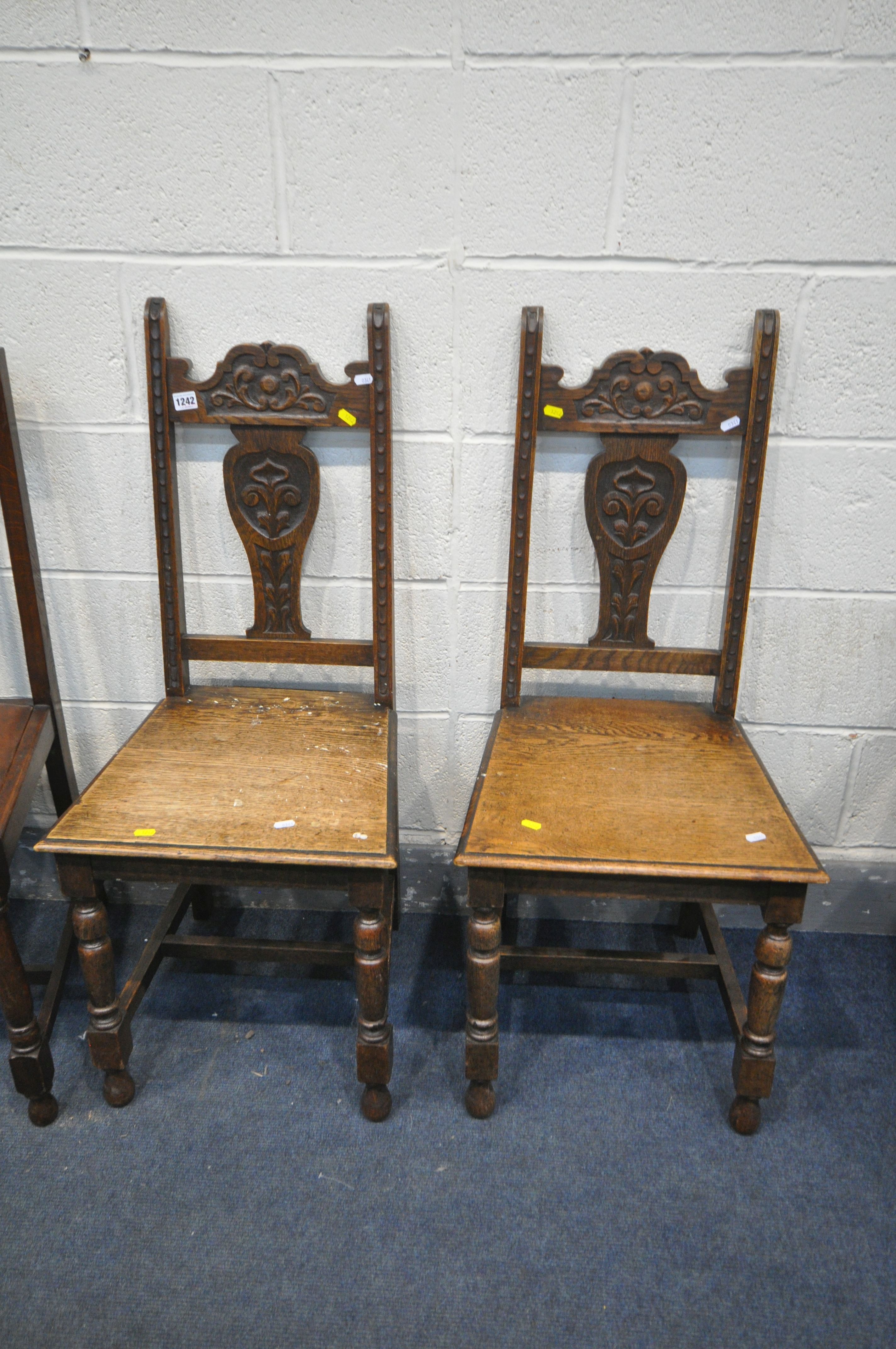 A PAIR OF CARVED OAK CHAIRS, along with a set of four chairs with drop in seat pads (condition:-once - Image 2 of 3