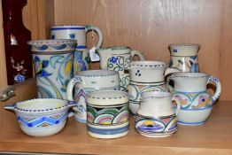 TEN PIECES OF HONITON POTTERY, all hand painted with abstract and foliate designs, including a ewer,