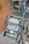 A WEBB PETROL LAWNMOWER, with grass box (condition:-untested but engine turns)