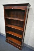 A HARDWOOD OPEN BOOKCASE, with three fixed shelves, and two drawers, width 99cm x depth 30cm x