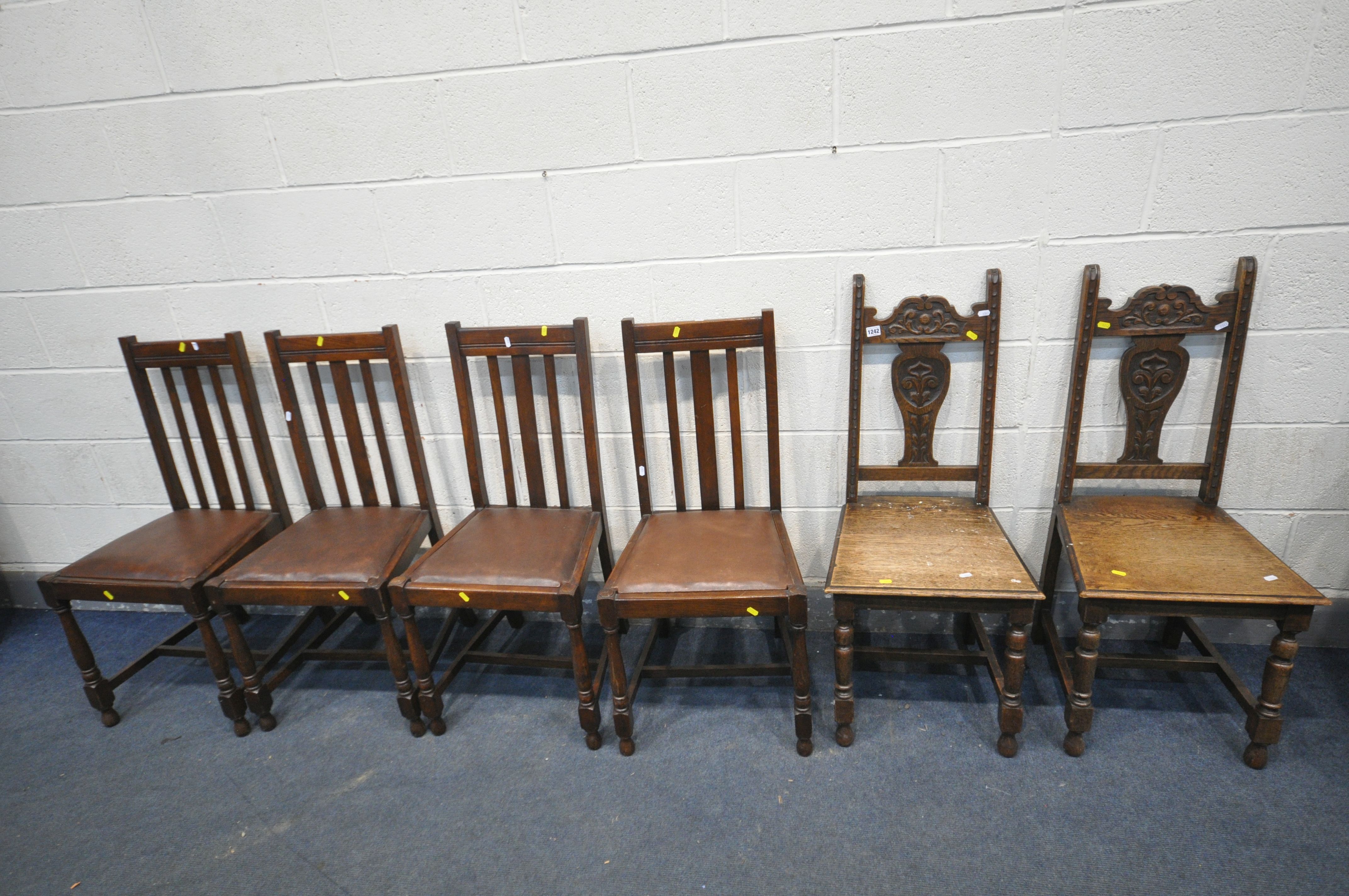 A PAIR OF CARVED OAK CHAIRS, along with a set of four chairs with drop in seat pads (condition:-once