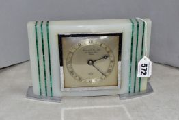 A GARRARD & Co ONYX AND MALACHITE MANTLE CLOCK, the chapter ring having roman numerals, the centre
