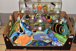 A BOX OF FISH ORNAMENTS IN CERAMIC, RESIN, WOOD AND GLASS, ETC, including a glass display case of