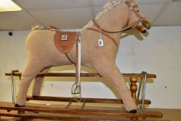 A MAMAS AND PAPAS ROCKING HORSE, height 79cm from the floor to top of head, length 112cm along