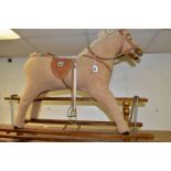 A MAMAS AND PAPAS ROCKING HORSE, height 79cm from the floor to top of head, length 112cm along