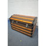 A VINTAGE CANVAS, WOODEN AND METAL BANDED DOMED TOP TRUNK, width 93cm x depth 54cm x height 63cm (