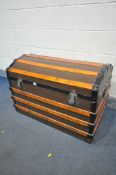 A VINTAGE CANVAS, WOODEN AND METAL BANDED DOMED TOP TRUNK, width 93cm x depth 54cm x height 63cm (