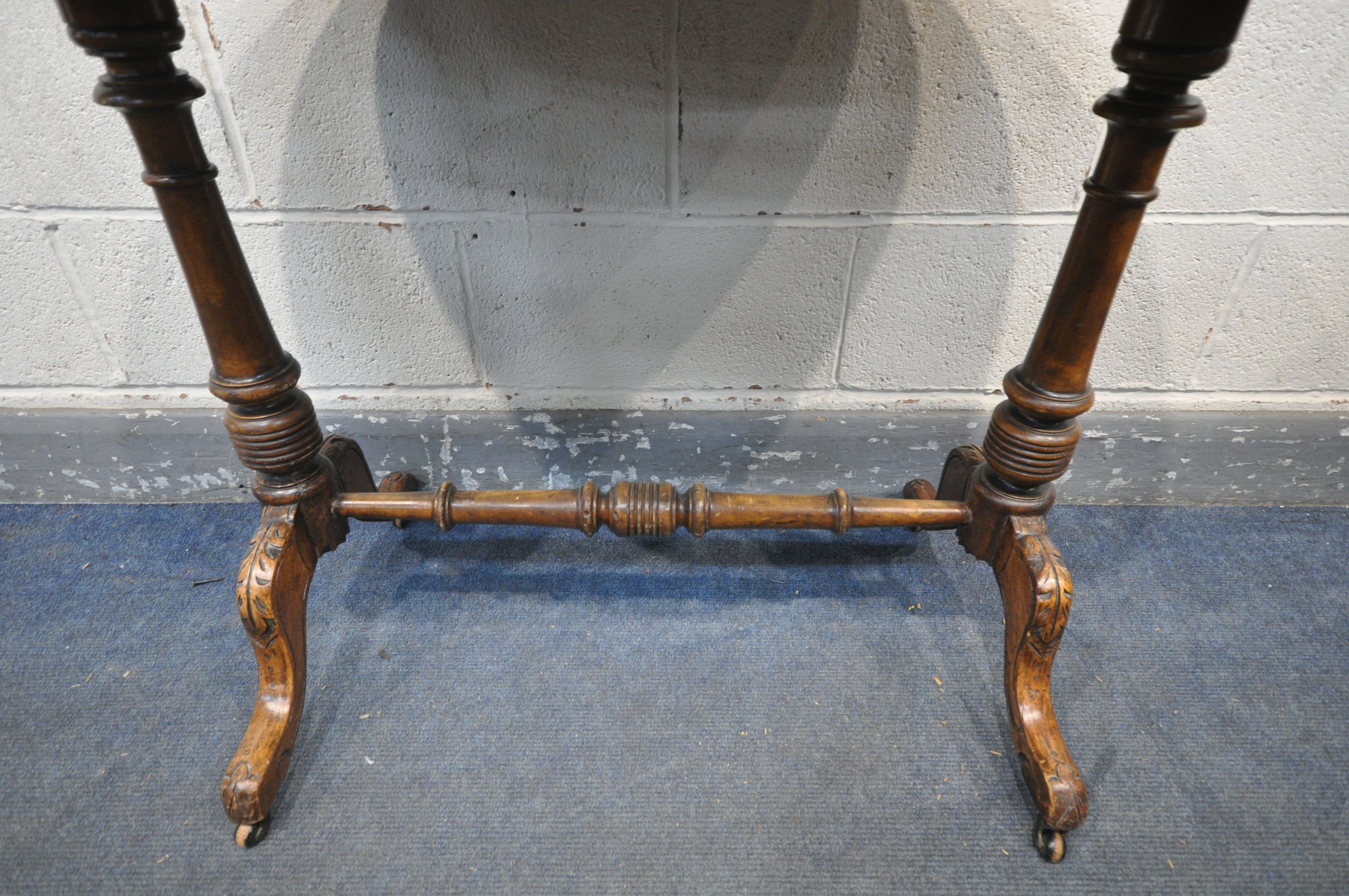 A VICTORIAN OVAL WALNUT CENTRE TABLE, with floral marquetry inlay, with turned supports, on carved - Image 5 of 6