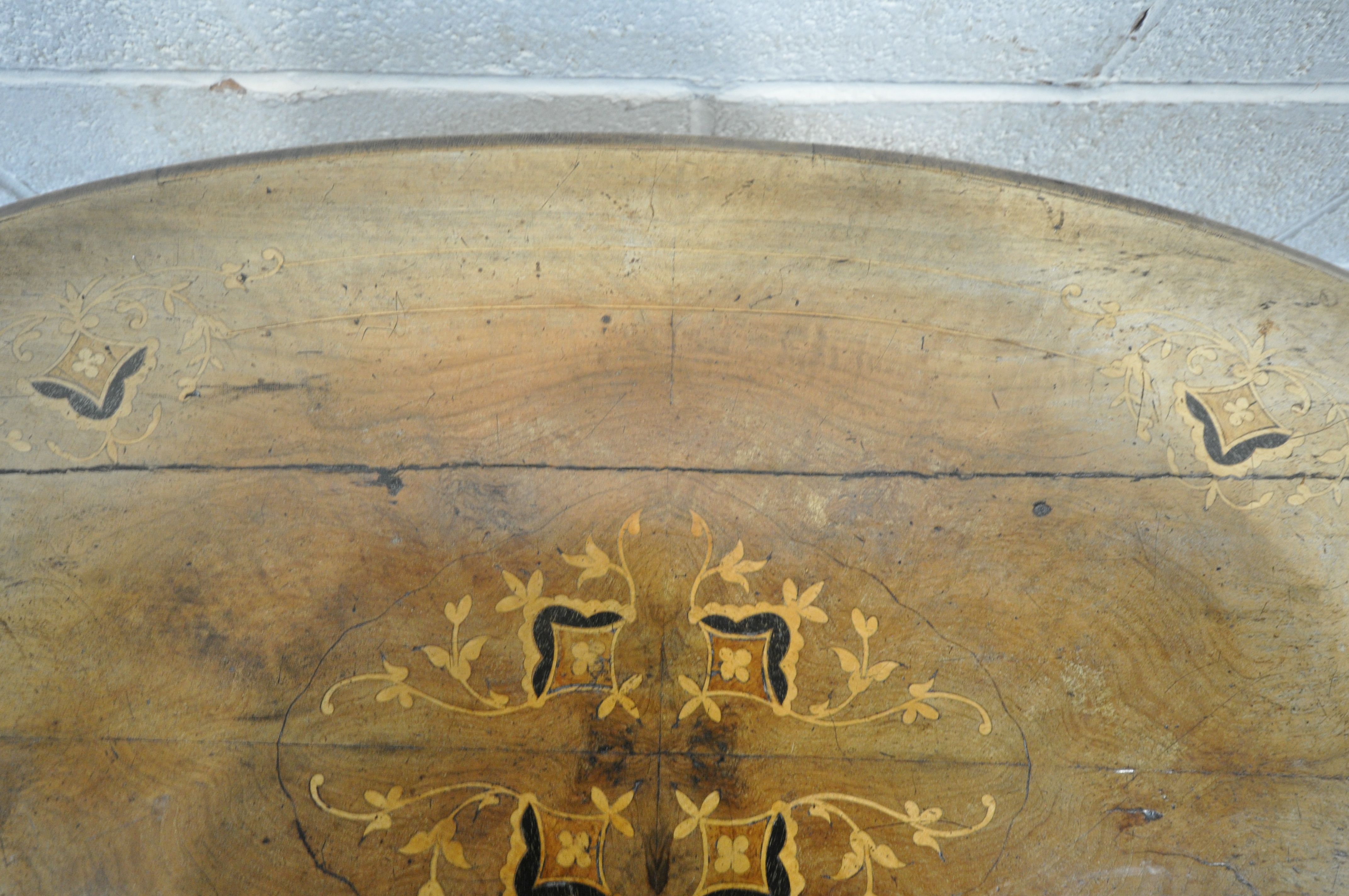 A VICTORIAN OVAL WALNUT CENTRE TABLE, with floral marquetry inlay, with turned supports, on carved - Image 6 of 6