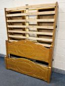 A PINE 4FT6 BEDSTEAD, with four drawers, along with a pine single headboard (2)
