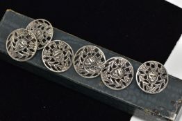 A SET OF SIX EARLY 20TH CENTURY SILVER BUTTONS, of circular pierced design, depicting a mythical