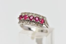 A WHITE METAL RUBY AND DIAMOND DRESS RING, designed as three rows, the central row set with five