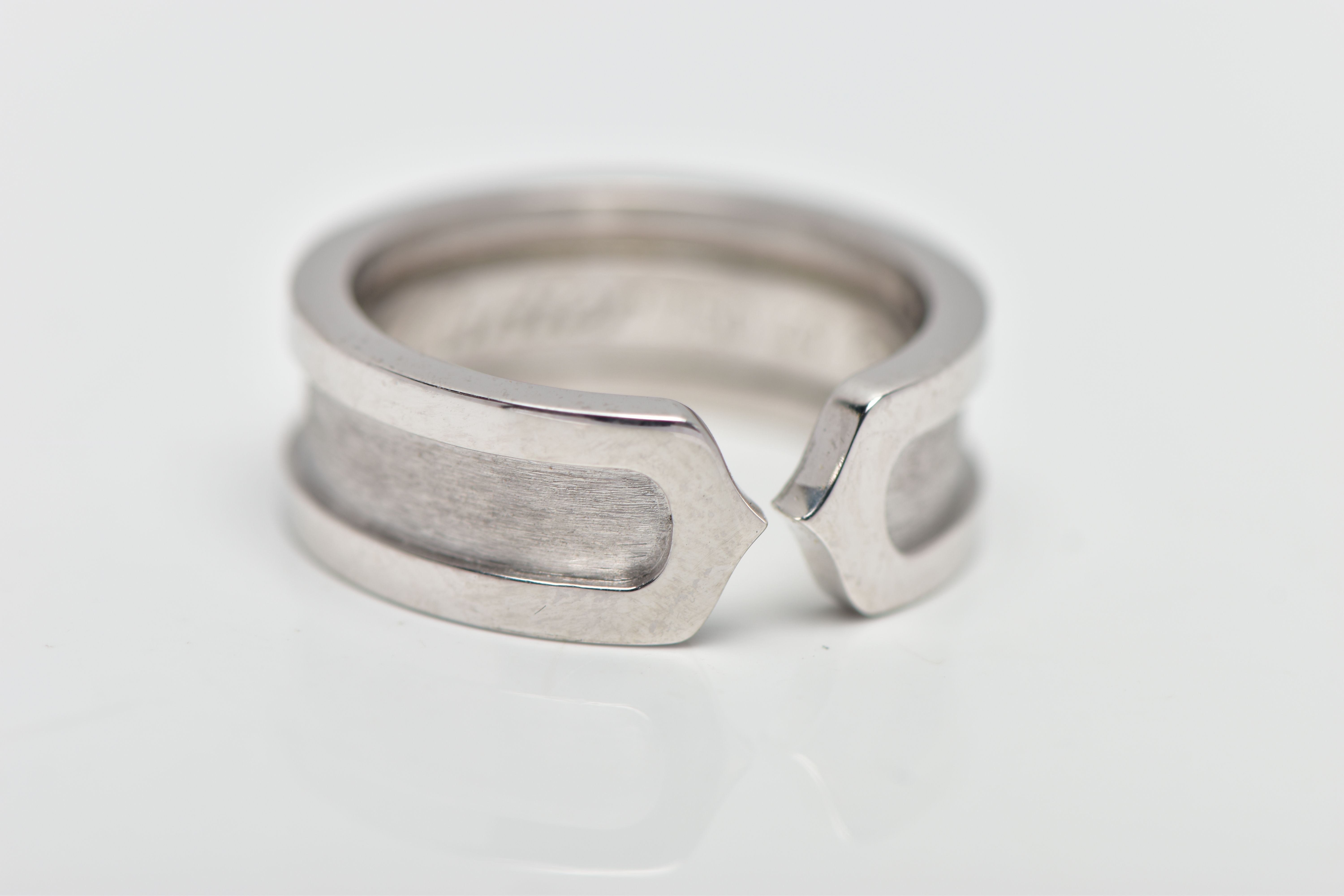 A 'C DE CARTIER' RING BY CARTIER, with polished and brushed detail, signed and numbered Cartier - Image 3 of 3
