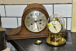 A 1930'S OAK CASED DOME TOP MANTEL CLOCK AND A KUNDO ANNIVERSARY CLOCK, the eight day oak clock with