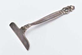 A 'GEORG JENSEN' DANISH SILVER BABY FOOD PUSHER, the plain egde to the tapered grooved handle with