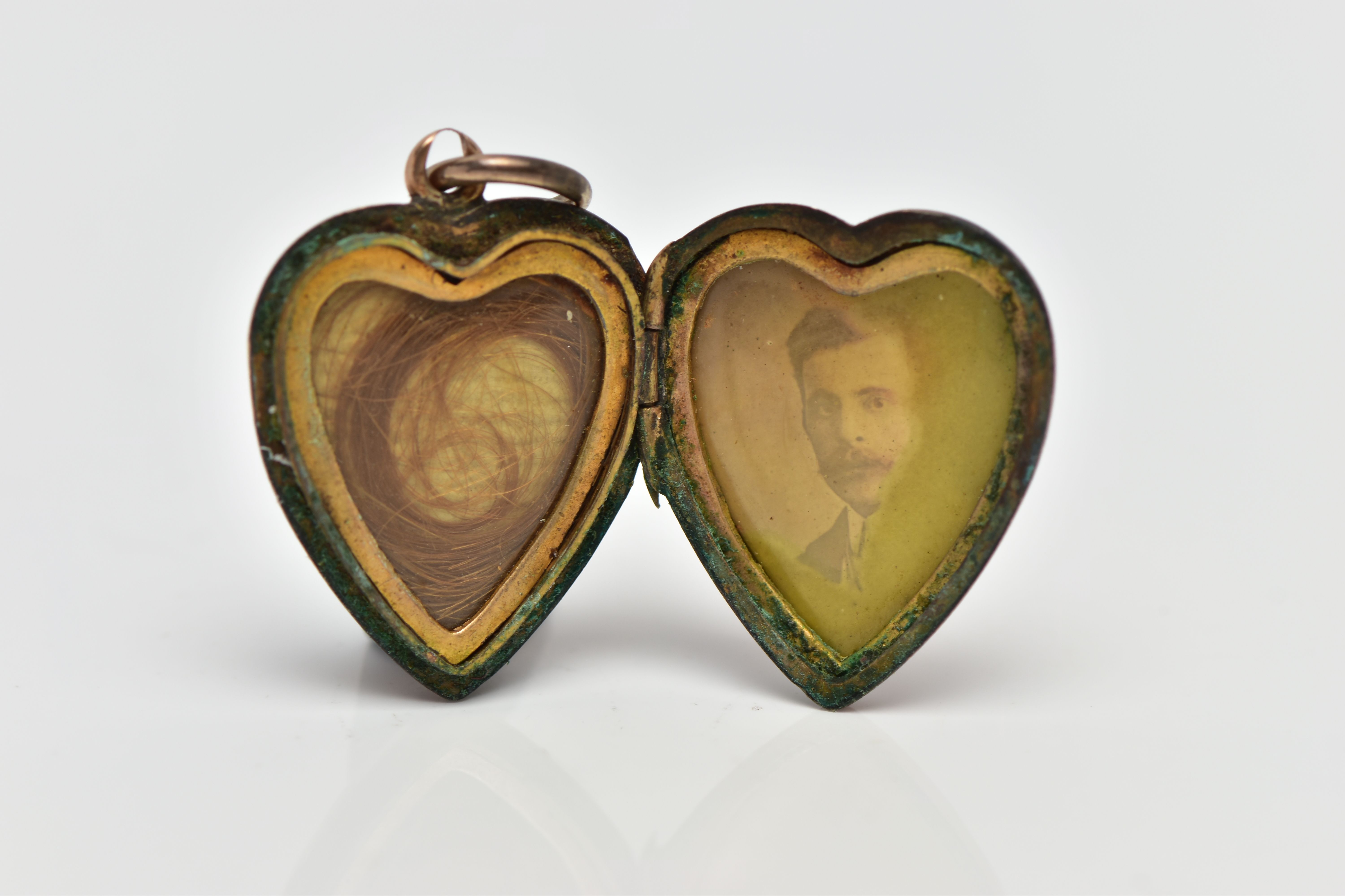 A LATE 19TH CENTURY GOLD LOCKET, a rose gold front and back locket of heart form, set with a - Image 2 of 2