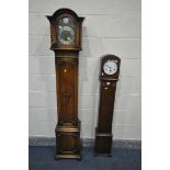 A 20TH CENTURY OAK CASED CHIMING GRANDAUGTHER CLOCK, the hood with barley twist pillars, flanking