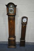 A 20TH CENTURY OAK CASED CHIMING GRANDAUGTHER CLOCK, the hood with barley twist pillars, flanking
