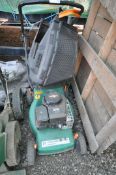 A PERFORMANCE POWER PETROL ROTARY LAWN MOWER, with grass box (untested but engine turns)
