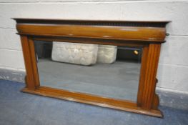 AN OAK FRAMED BEVELLED EDGE OVERMANTEL MIRROR, 140cm x 74cm (condition:-small chip to left top