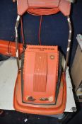 A FLYMO XE400 SPRINTMASTER LAWN MOWER with grass box along with a Flymo garden vac model No