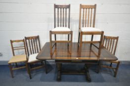 AN OAK DRAW LEAF DINING TABLE, on twin acorn legs, open length 153cm x closed length 92cm x depth