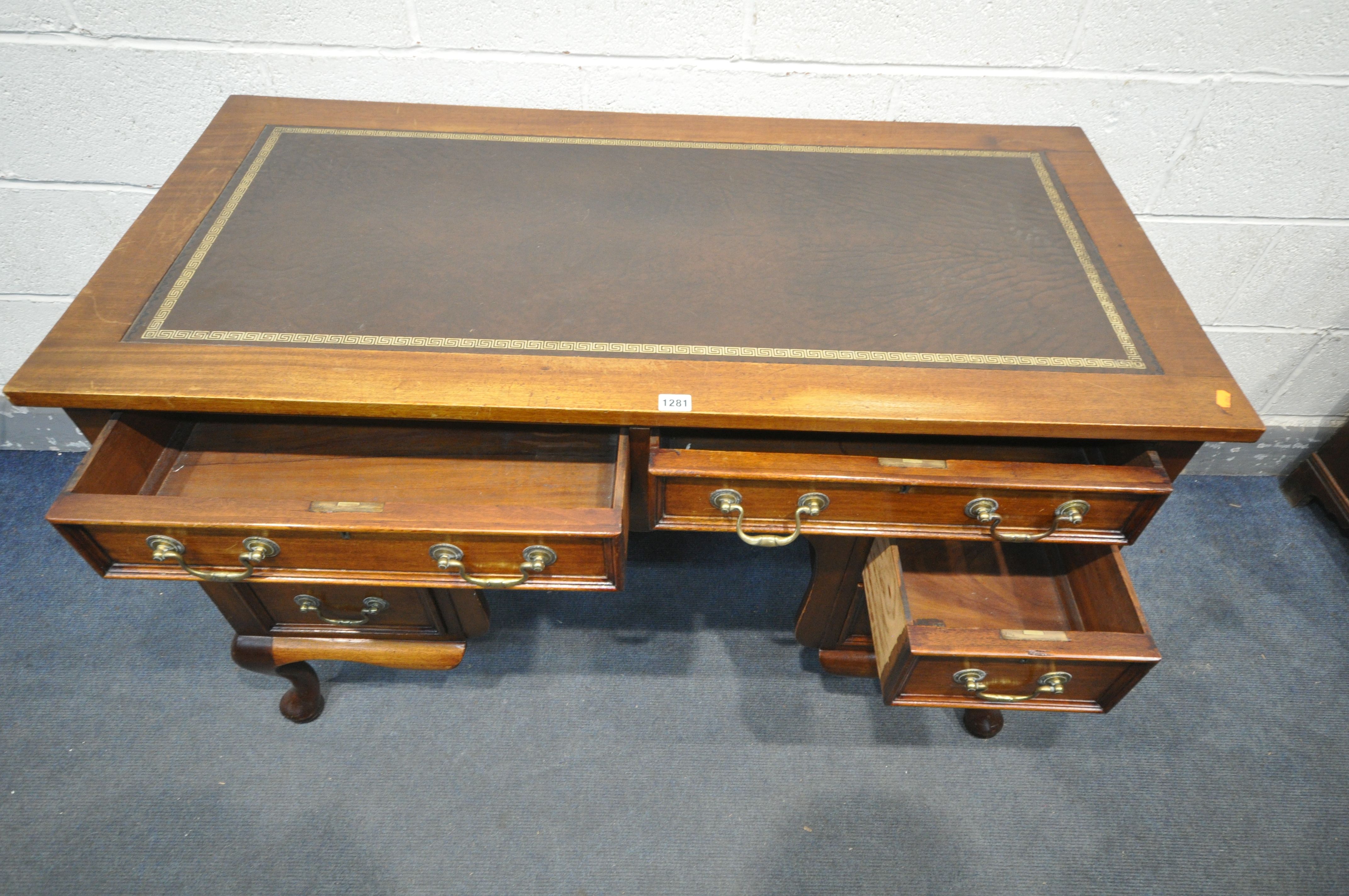 A 20TH CENTURY MAHOGANY KNEE HOLE DESK, with brown tooled leather inlay, an arrangement of six - Image 4 of 4