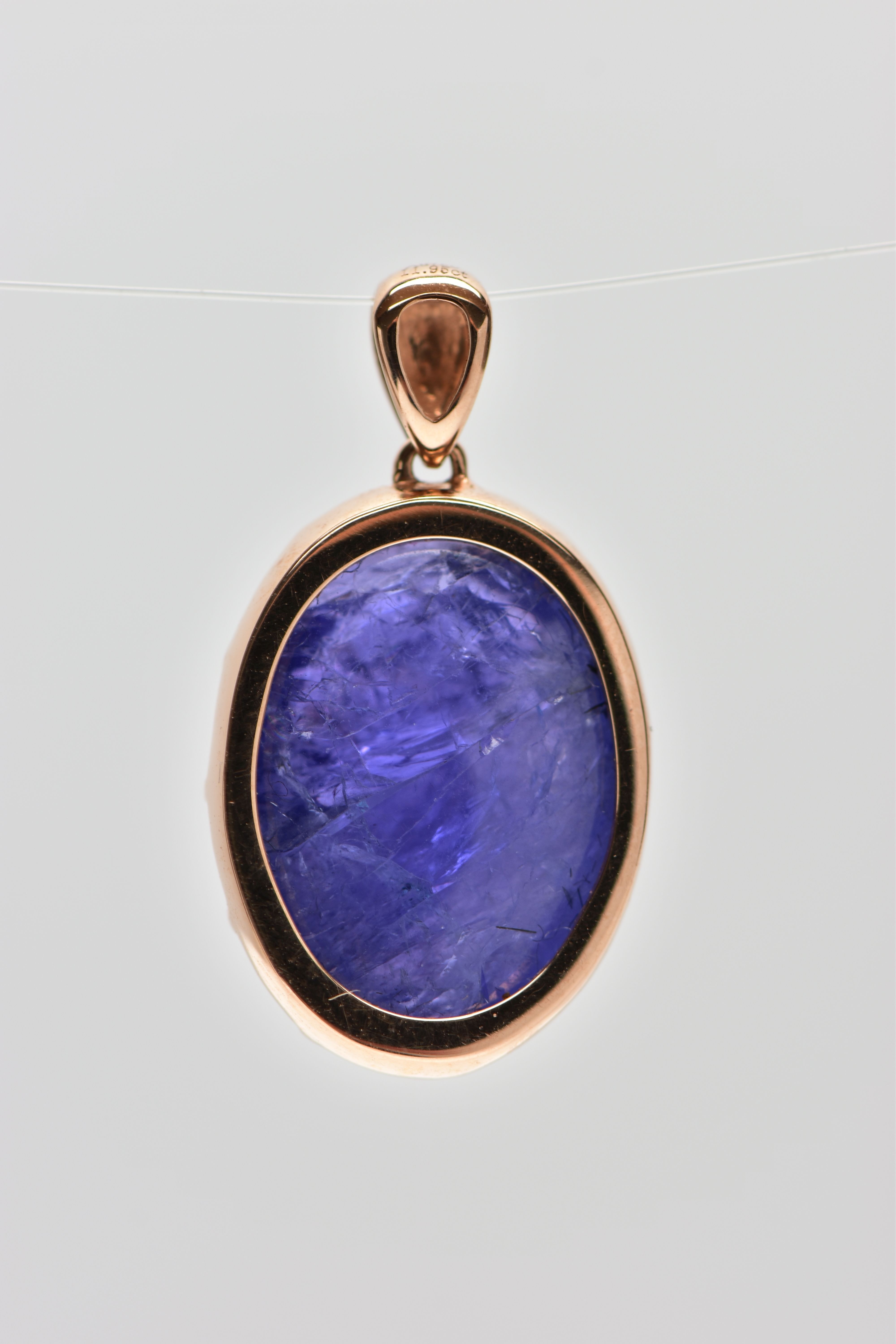 A TANZANITE CABOCHON PENDANT, comprising an oval tanzanite cabochon within a claw setting to the - Image 3 of 3