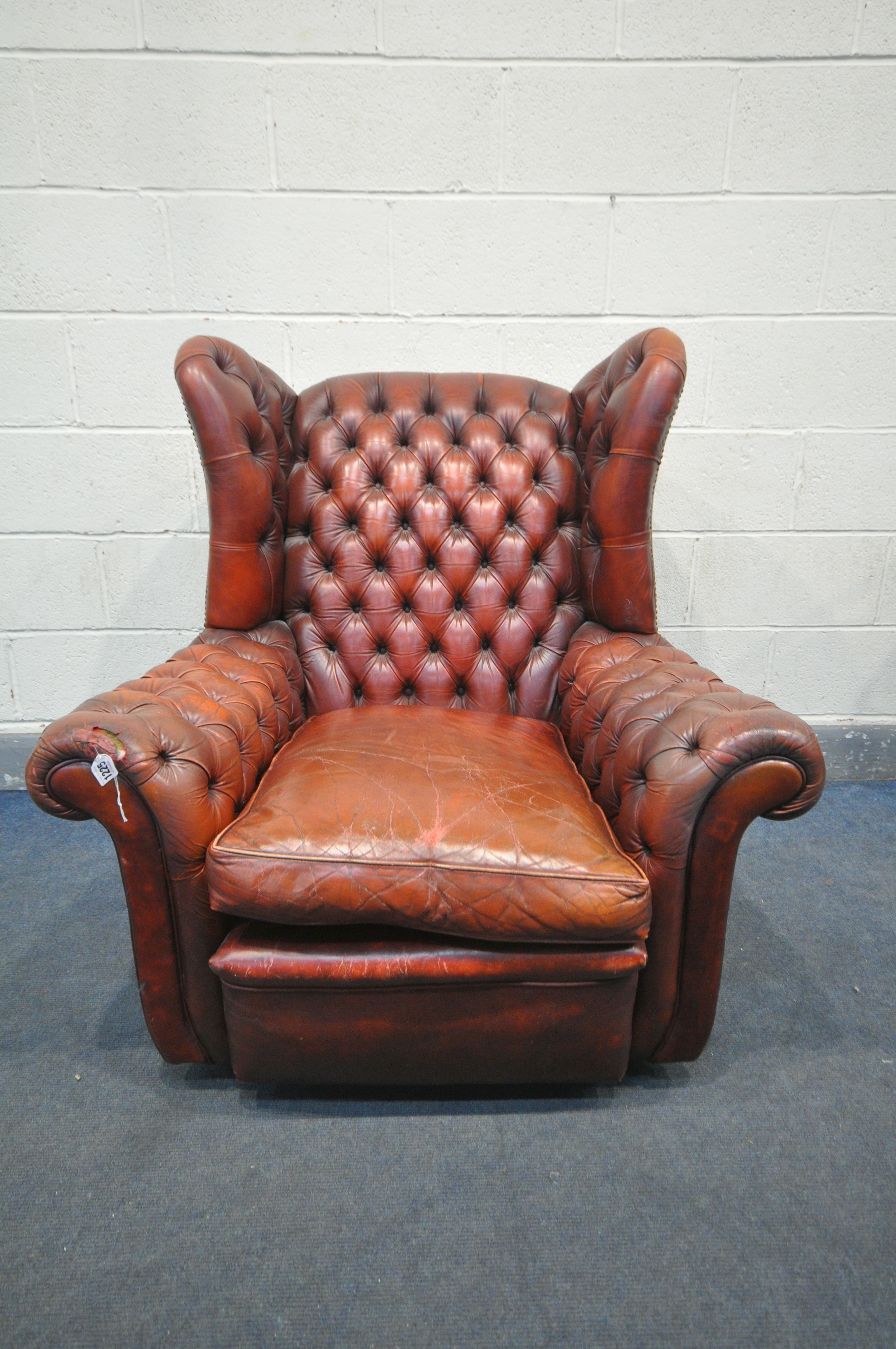 A BUTTONED OXBLOOD LEATHER ARMCHAIR, width 100cm x depth 106cm x height 104cm (condition:-torn - Image 2 of 5