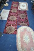 A SELECTION OF RUGS, to include three Chinese woollen rugs, largest rug size, 152cm x 89cm and a