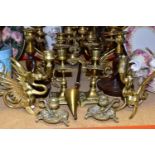 A GROUP OF BRASS CANDLESTICKS, fourteen pieces to include six candlesticks in the form of dragons, a