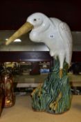 A LARGE STATUE OF AN EGRET, very heavy stoneware 'Majolica style' white egret set in reeds, height