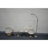 A SELECTION OF LIGHTING, to include two brass table lamps, an adjustable floor lamp, and four