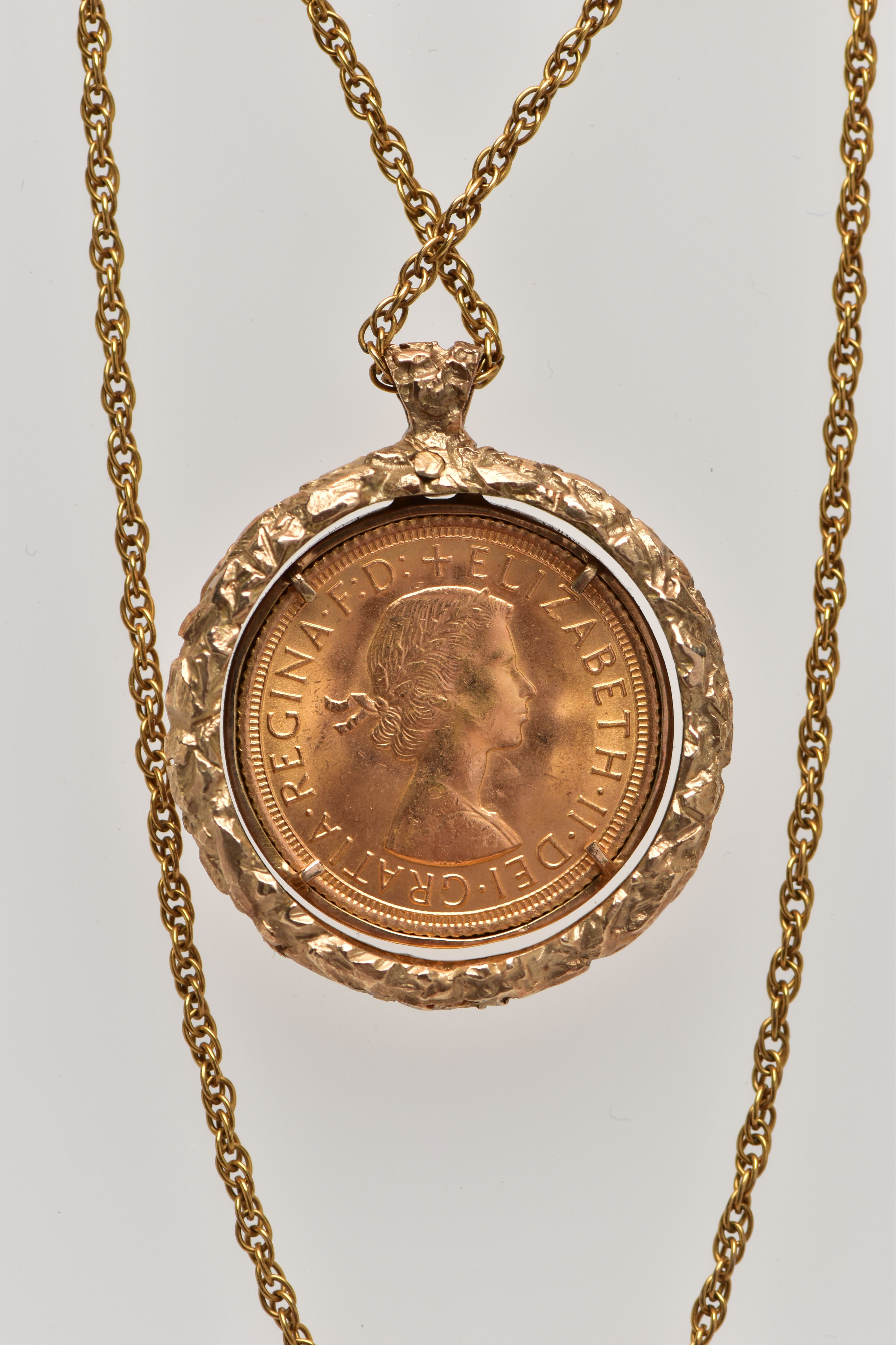 A 1970'S 9CT YELLOW GOLD PENDANT WITH FULL SOVEREIGN, the textured pendant, suspending a full - Image 2 of 2