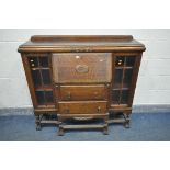 AN EARLY TO MID 20TH CENTURY OAK SIDE BY SIDE BUREAU BOOKCASE, on stretchered support and shaped