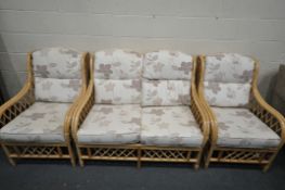 A WICKER CONSERVARORY SUITE, comprising a two seater settee and a pair of armchairs