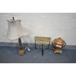 A COPPER AND BRASS SAMOVAR, along with a brass trivet and a table lamp with a fabric shade (crack to