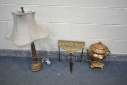 A COPPER AND BRASS SAMOVAR, along with a brass trivet and a table lamp with a fabric shade (crack to