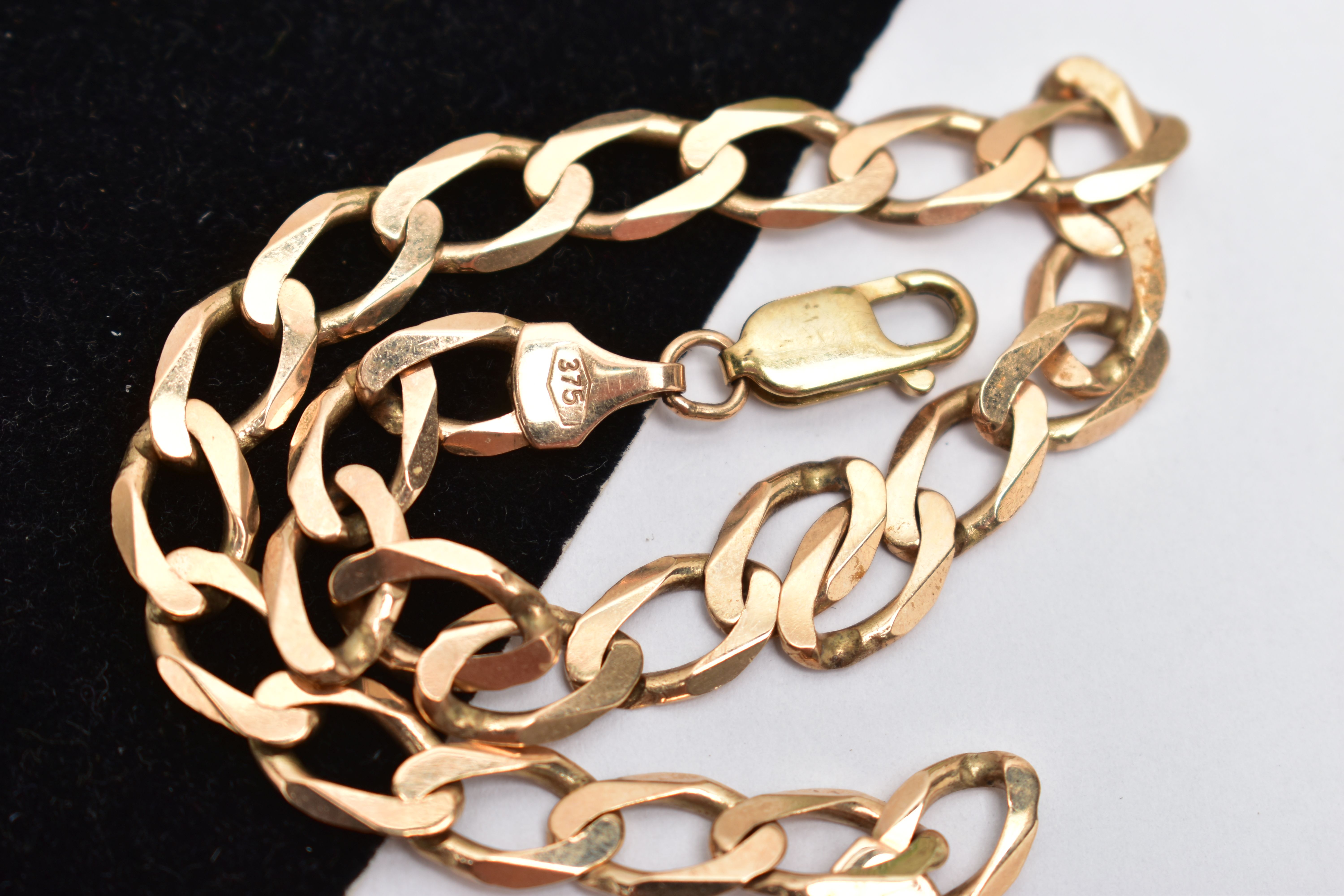 A 9CT YELLOW GOLD BRACELET, designed as a flat curb link chain with lobster clasp, approximate - Image 2 of 2