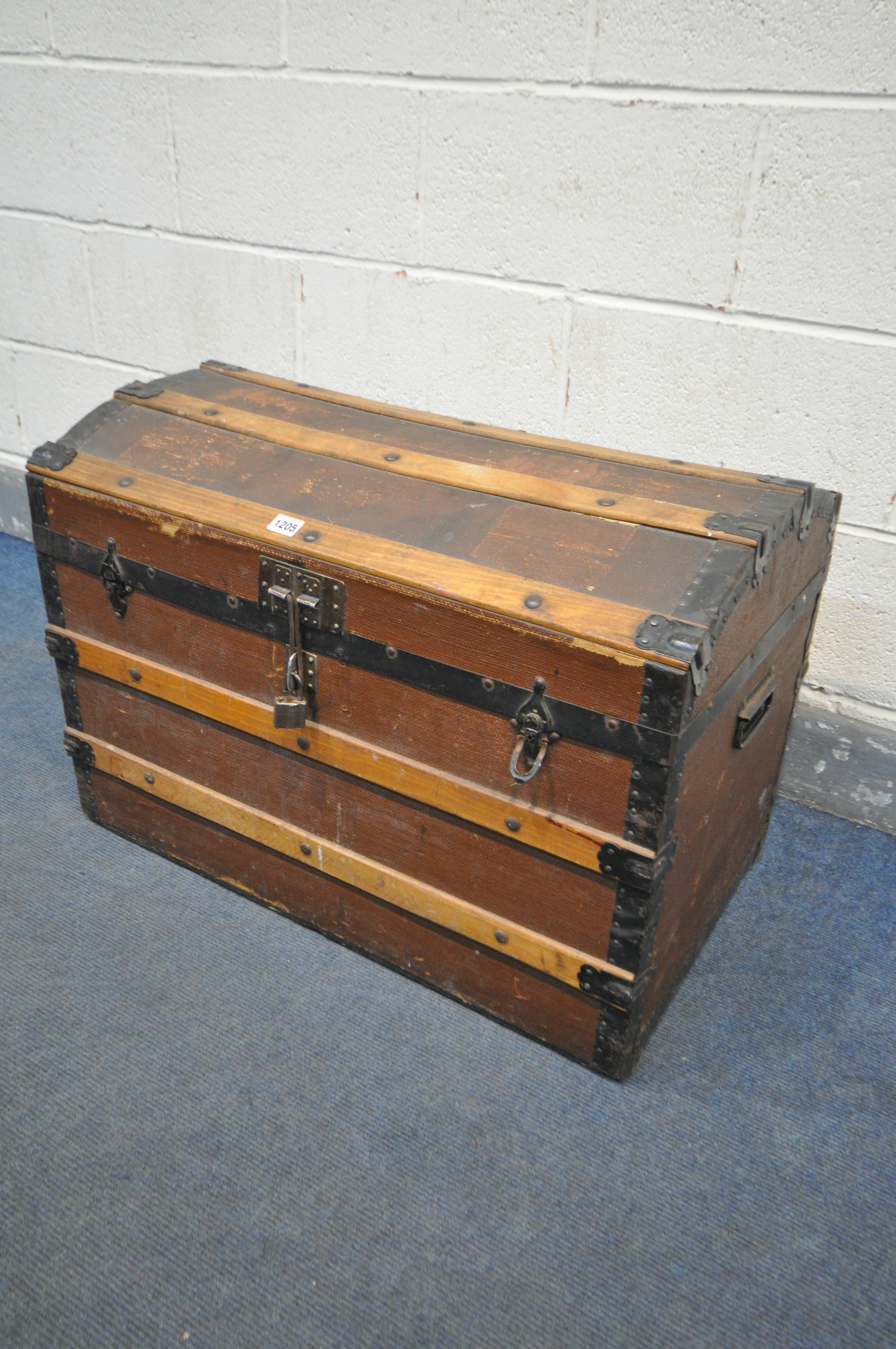 A VINTAGE DOMED TOP TRUNK, with wooden and metal banding, width 76cm x depth 46cm x height 54cm (