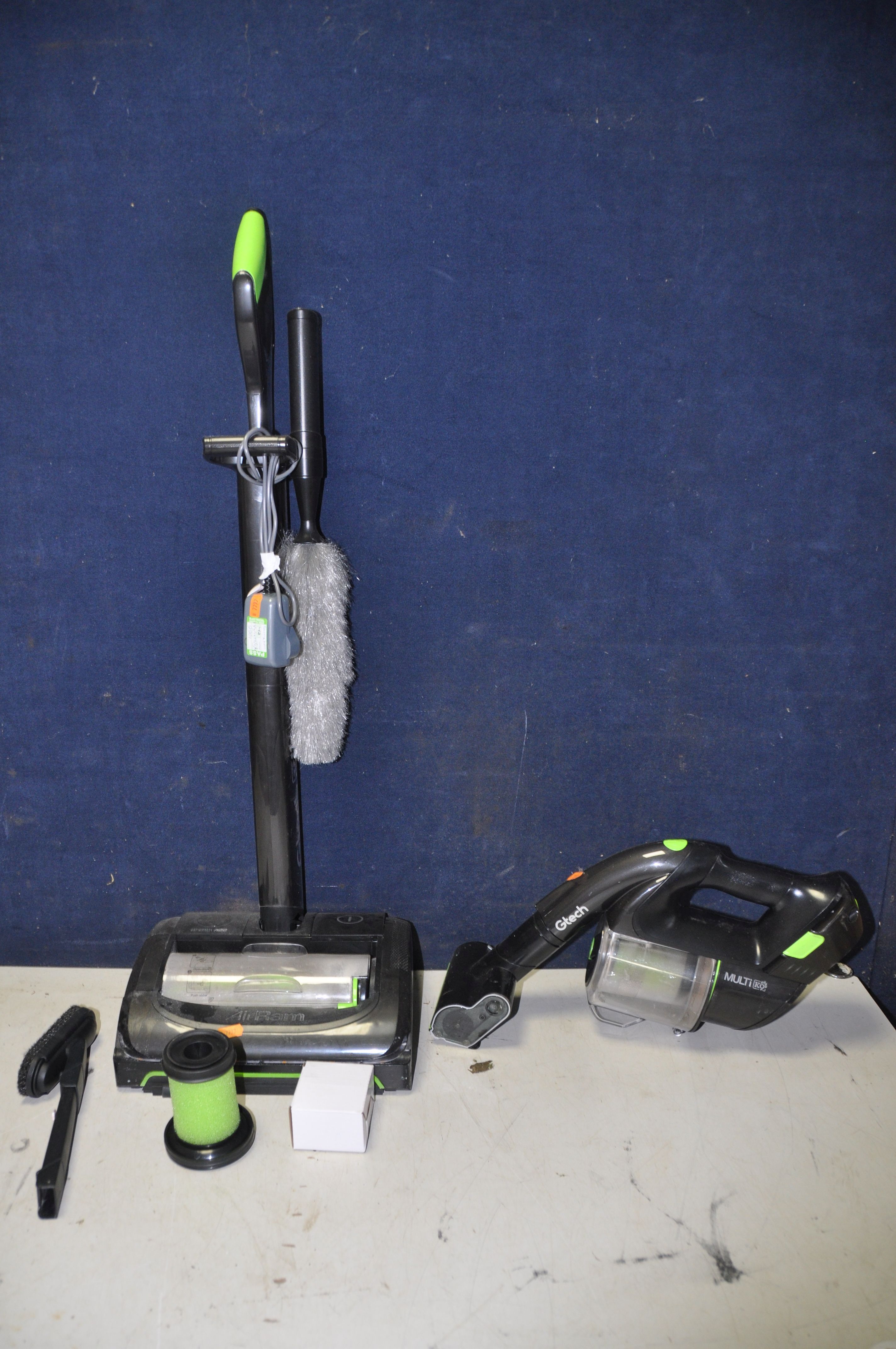 A G-TECH AIR RAM K9 VACUUM with charger, along with a G-tech multi K9 with spare filter and air