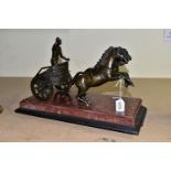 A BRONZE FIGURE OF A ROMAN CHARIOTEER, on a rouge marble base, length 42cm x width 21cm (1) (