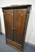 A MODERN STAINED PINE DOUBLE DOOR WARDROBE, above two drawers, width 101cm x depth 58cm x height