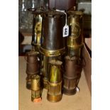 MINERS LAMPS, a collection of three standard size miners lamps and four small miners lamps, two of